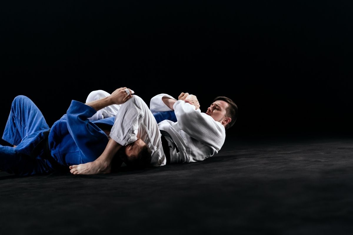 Male Judo Player Choking with Legs