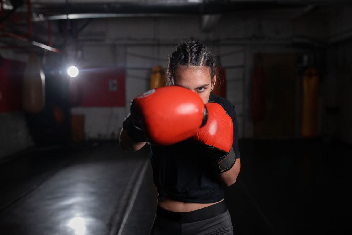 Young female shadow boxing